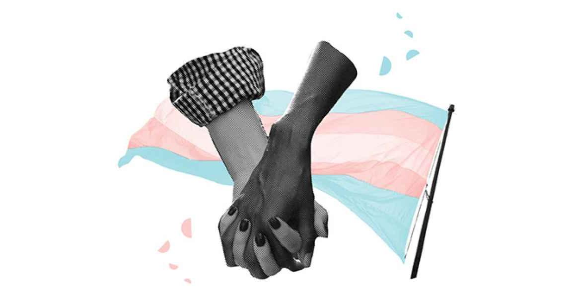 Two arms holding hands in front of the trans pride flag